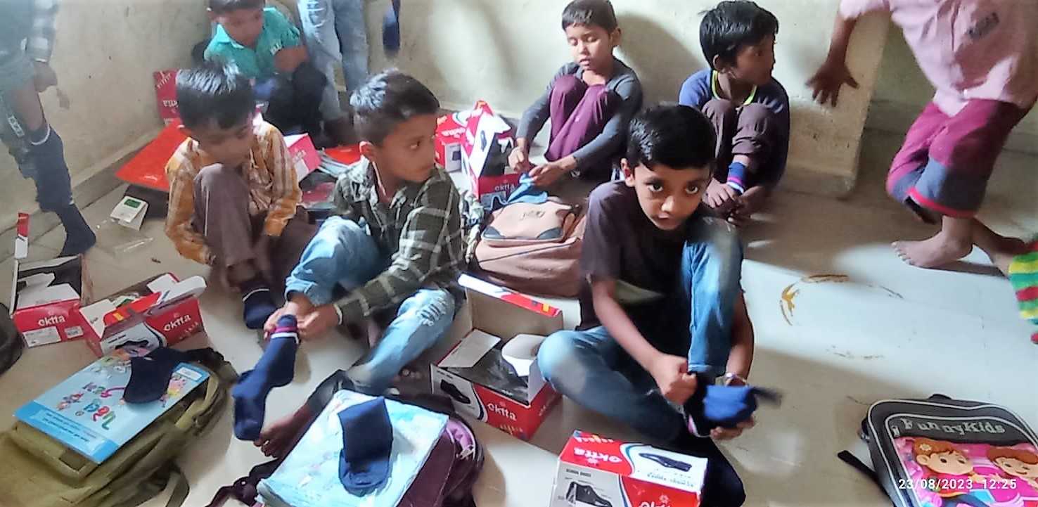 On 23-8-23,  we distributed shoes and socks at the village Hebatpur taluka Dasada, Gujarat.
We distributed shoes and socks to 150  school children of std.1 to 5 of the primary school of Hebatpur Village as a part of health awareness for small children of the villages. The children had been waiting since 11 Aug, when we had taken their measurements. They were beaming with joy on receiving the shoes and socks.  The Sarpanch of the village and elderly seniors remain present.  
